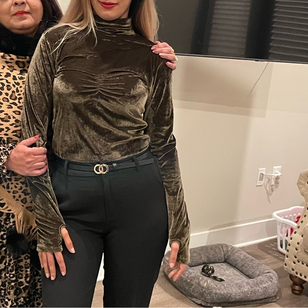 Velvet turtle neck in a vibrant bottle green.